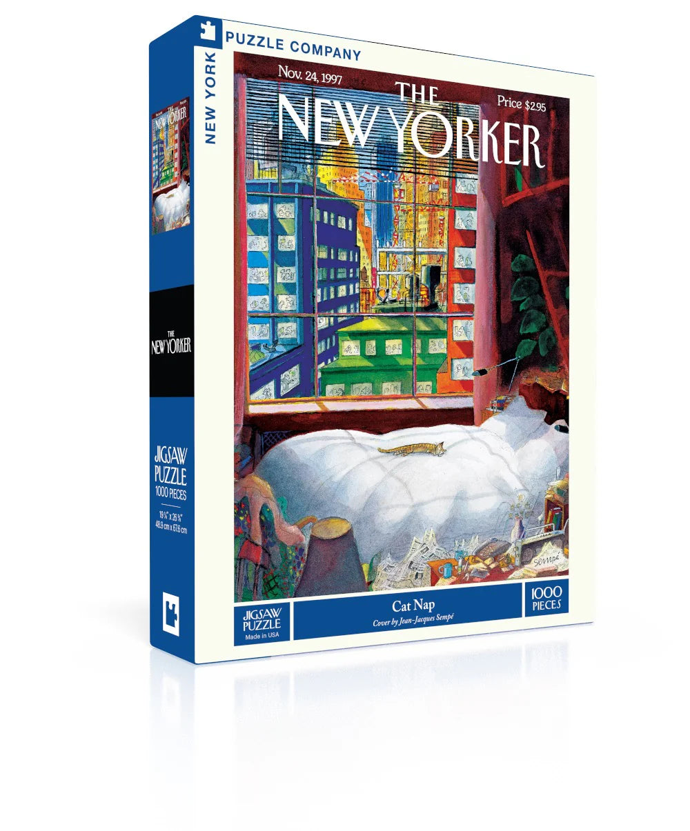 New York Puzzle Company Cat Nap 1000-piece jigsaw puzzle featuring a relaxed sleeping cat in a cozy home surrounded by warm, peaceful everyday details.
