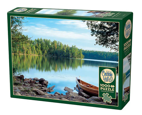 Cobble Hill Nature's Mirror 1000-piece jigsaw puzzle featuring a stunning mountain lake reflecting forests, blue skies, and breathtaking natural scenery.