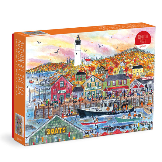 Galison Michael Storrings Autumn By the Sea 1000-piece jigsaw puzzle featuring colorful autumn foliage along a peaceful coastal landscape.