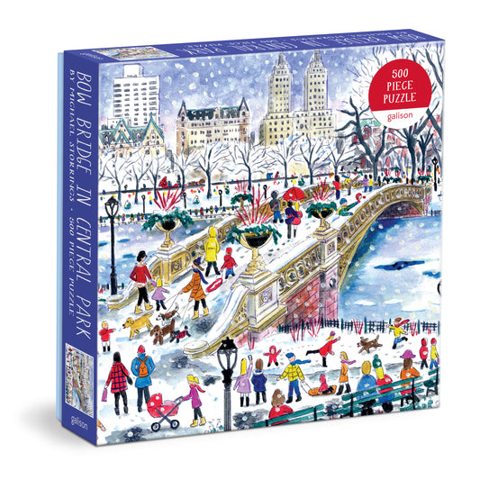 Galison Michael Storrings Bow Bridge in Central Park 500-piece jigsaw puzzle featuring the iconic Bow Bridge surrounded by beautiful trees, peaceful water, and picturesque Central Park scenery.