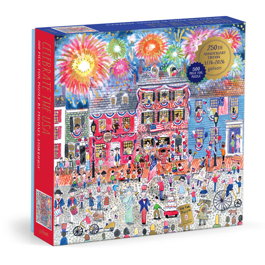 Galison Michael Storrings Celebrate The USA 500-piece foil jigsaw puzzle featuring iconic American landmarks, patriotic celebrations, and shimmering foil details.