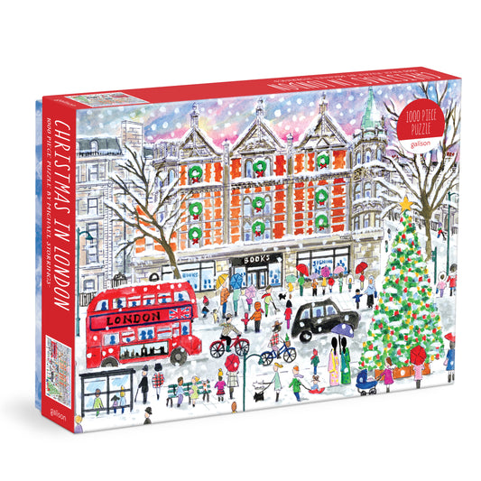 Galison Michael Storrings Christmas in London 1000-piece jigsaw puzzle featuring festive London streets decorated with holiday lights and seasonal celebrations.