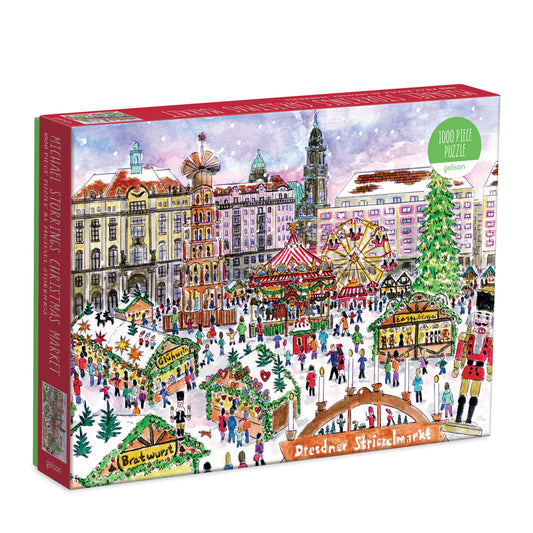 Galison Michael Storrings Christmas Market in Dresden 1000-piece jigsaw puzzle featuring the famous Dresden Christmas market with festive stalls, sparkling lights, traditional holiday treats, and historic European architecture.