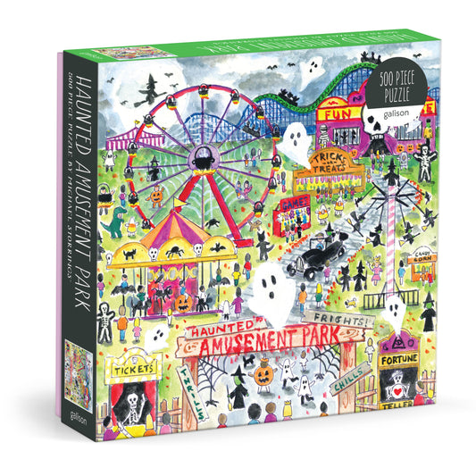 Galison Michael Storrings Haunted Amusement Park 500-piece jigsaw puzzle featuring a spooky amusement park filled with haunted rides, Halloween decorations, glowing lights, and festive autumn fun.