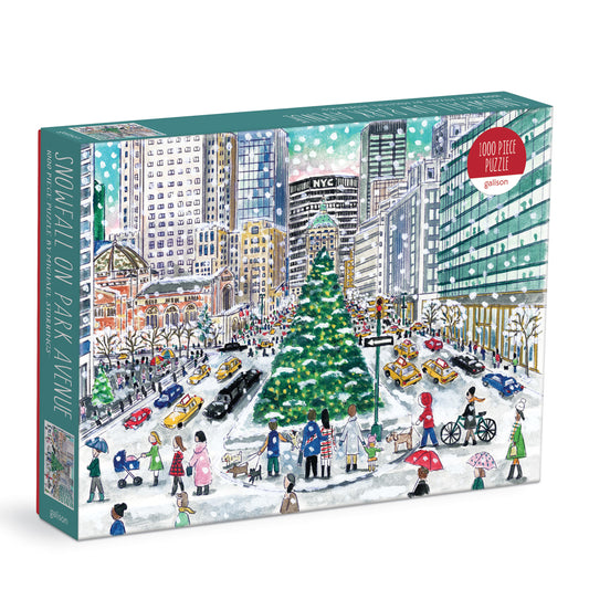 Galison Michael Storrings Snowfall on Park Avenue 1000-piece jigsaw puzzle featuring snow-covered Park Avenue with festive holiday decorations, elegant buildings, and a magical winter atmosphere.