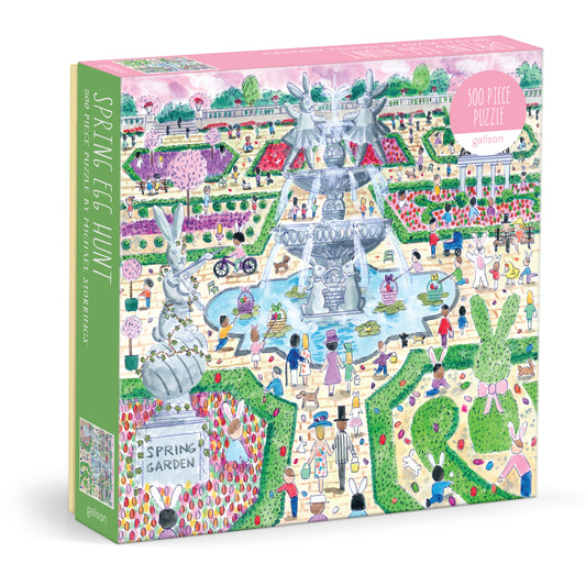 Galison Michael Storrings Spring Egg Hunt 500-piece jigsaw puzzle featuring a cheerful spring egg hunt with colorful Easter eggs, blooming flowers, playful children, and festive outdoor fun.