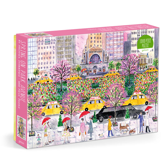 Galison Michael Storrings Spring on Park Avenue 1000-piece jigsaw puzzle featuring Park Avenue in full spring bloom with colorful flowers, elegant buildings, and vibrant New York City streets.