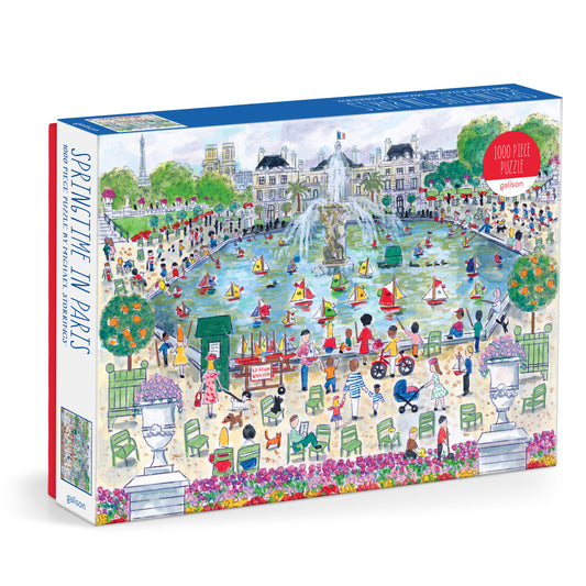 Galison Michael Storrings Springtime in Paris 1000-piece jigsaw puzzle featuring blooming flowers, Paris streets, and the beauty of spring.